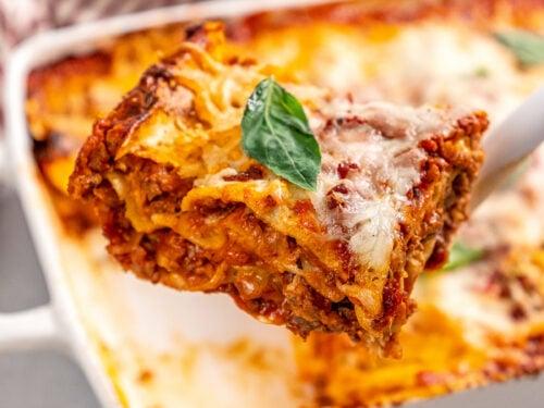 a freshly baked lasagna with golden brown cheese, steaming and ready to be served