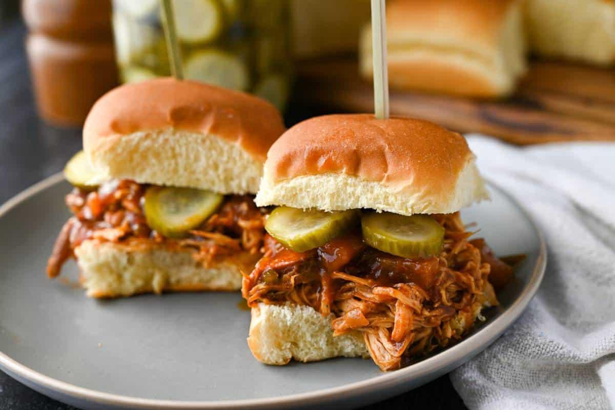 Assembled Pineapple Salsa BBQ Chicken Sliders on a serving platter