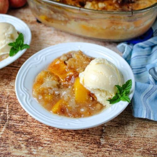 milk chocolate peach cobbler served warm with ice cream