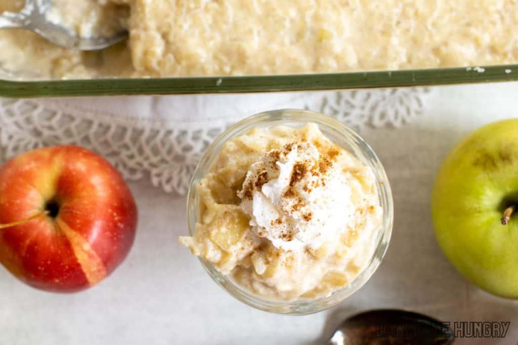 Overhead shot of Apple Crisp Rice Pudding in a glass bowl