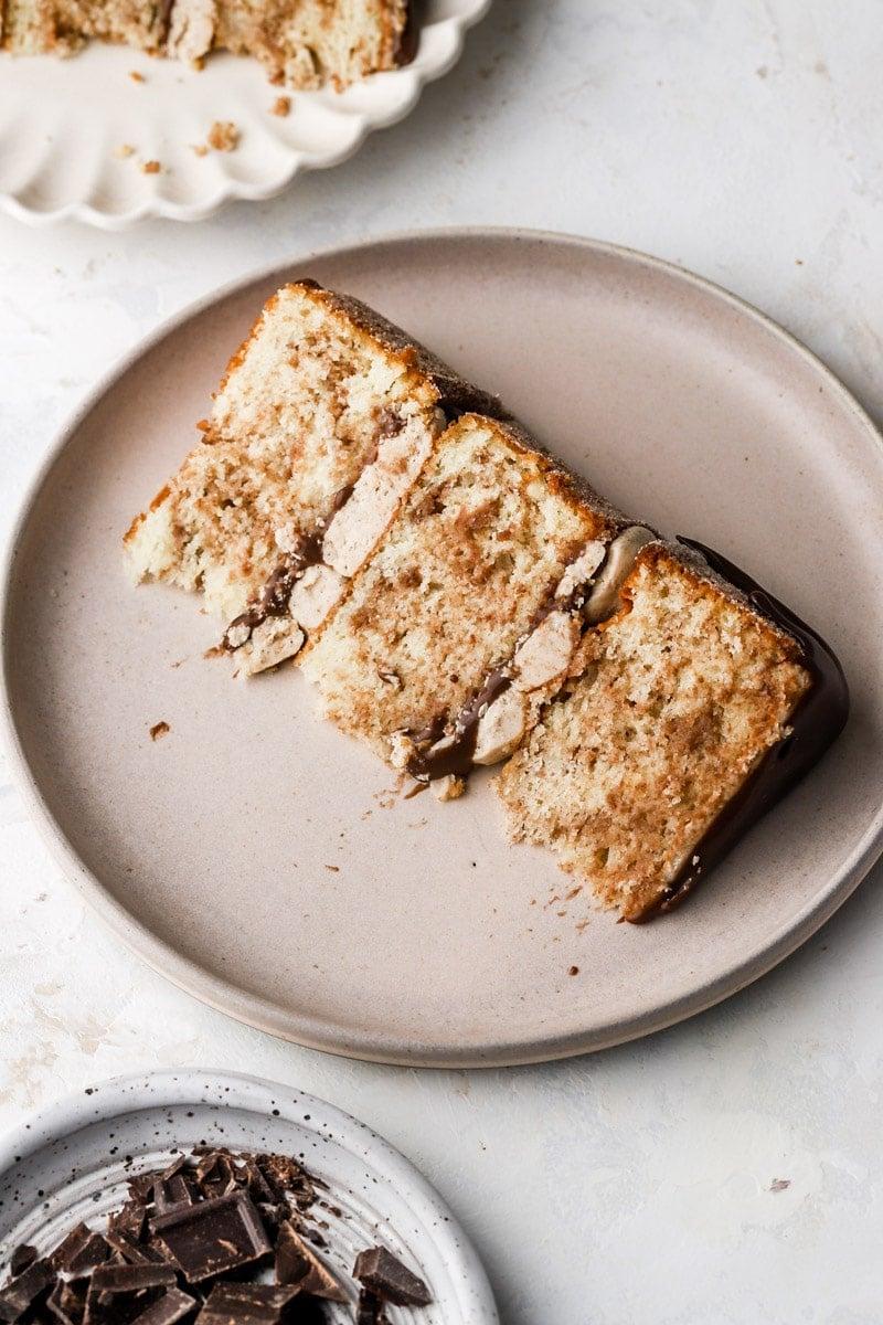 close up shot of slicing into a Churro Swiss Roll showing the swirl of cake and frosting