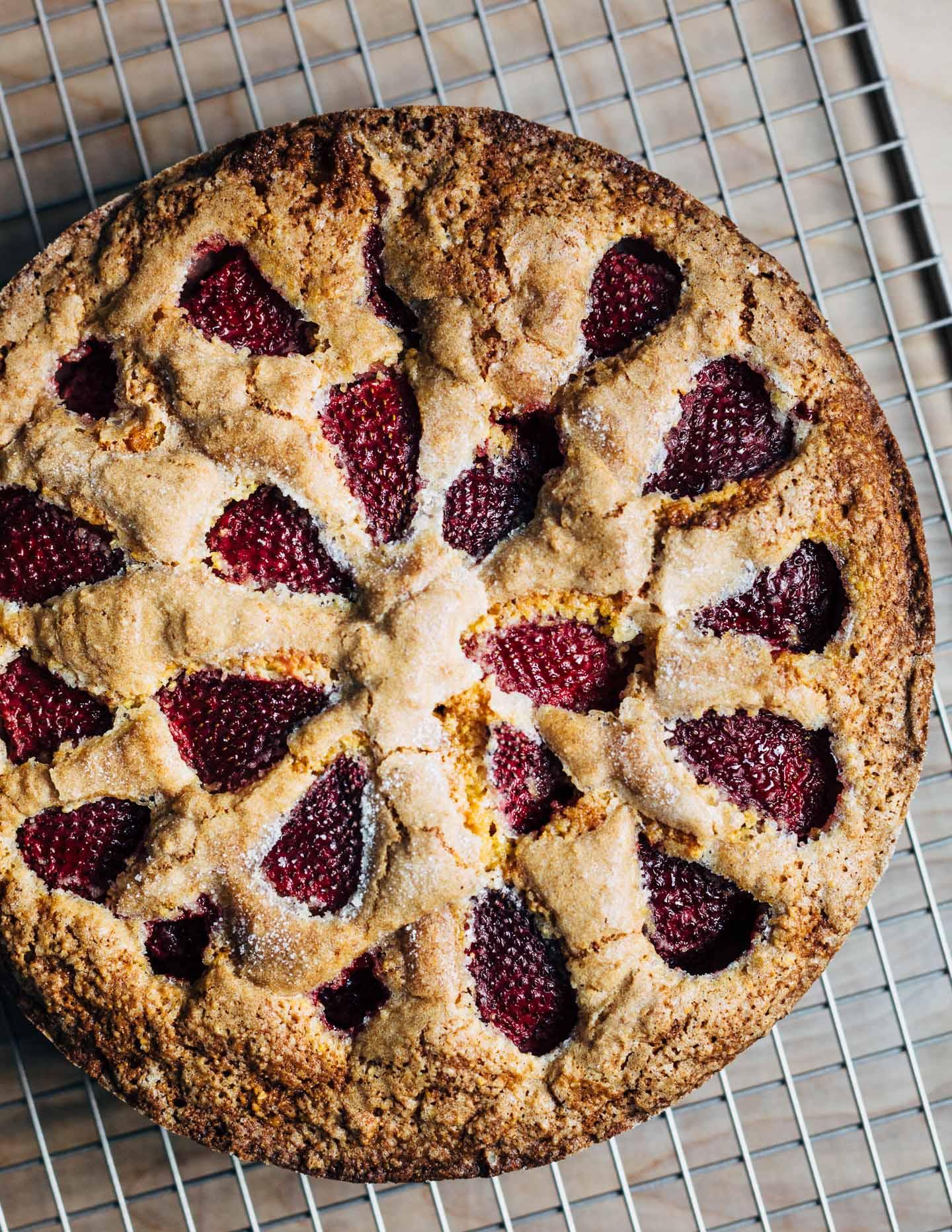 rustic strawberry cornmeal cake on a wooden table