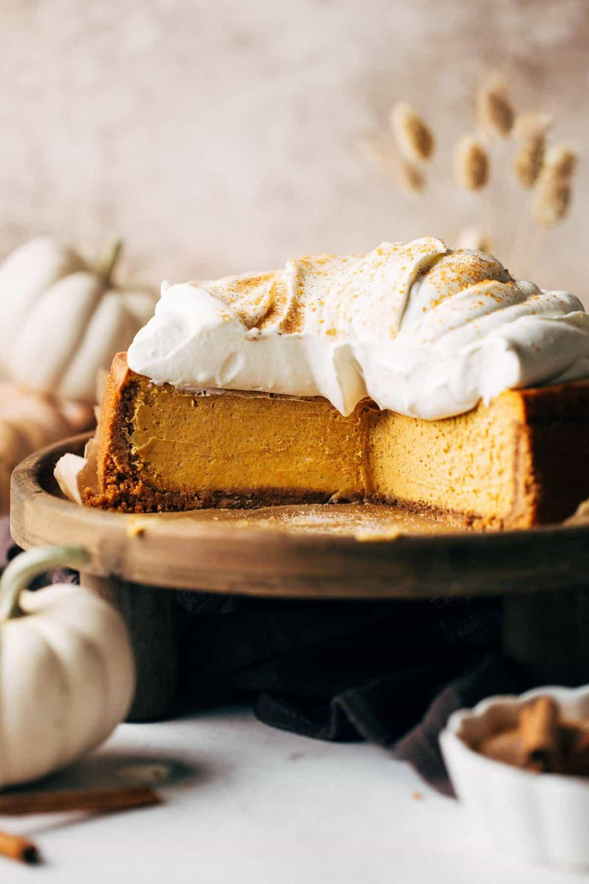 Close-up shot of a freshly baked Snickerdoodle Pumpkin Cheesecake in a springform pan