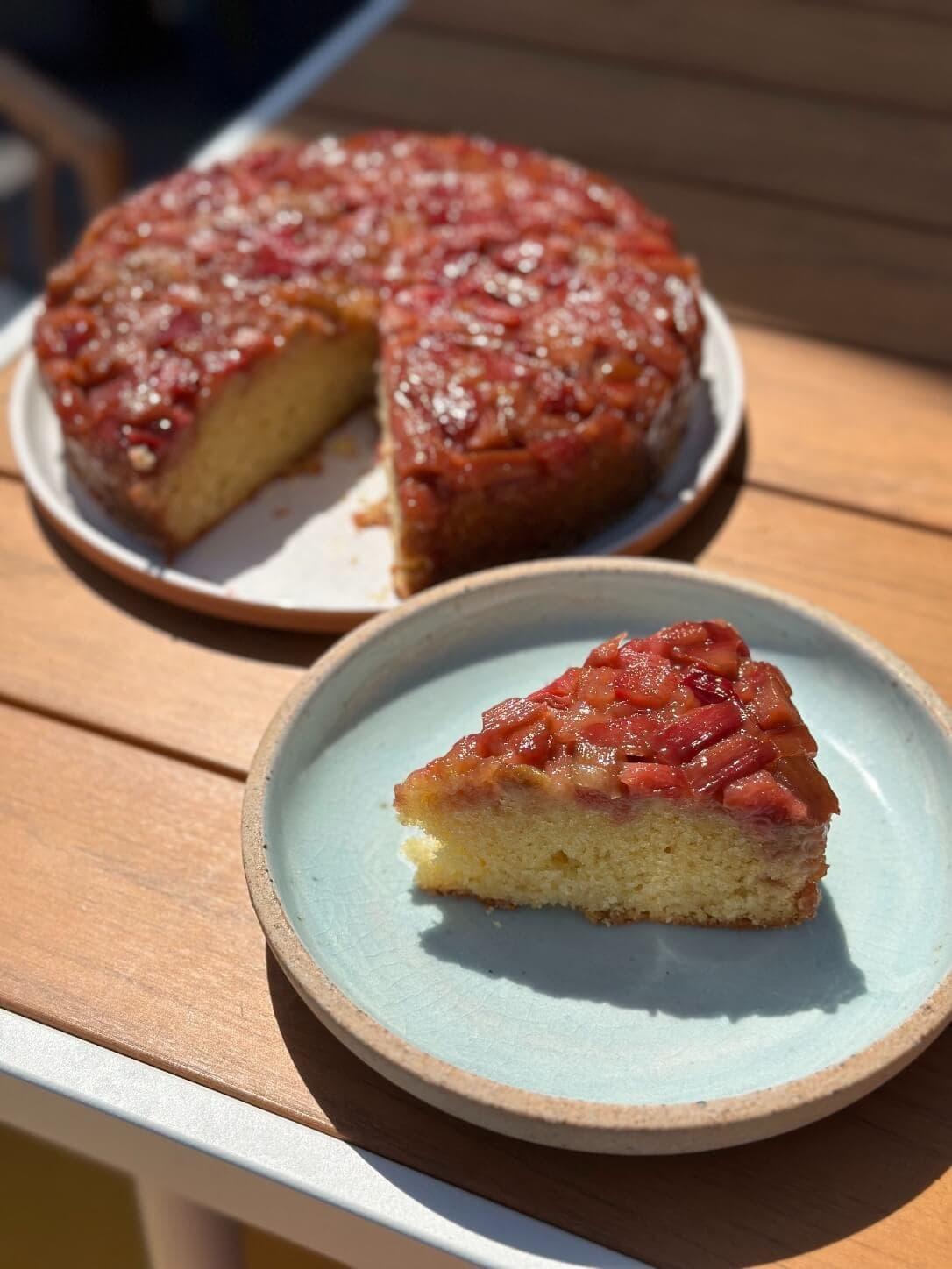 overhead shot of rhubarb and yogurt cake on a rustic wooden table