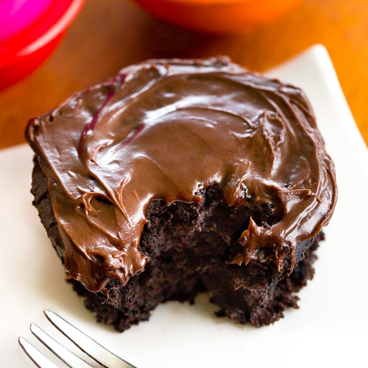 close-up of someone taking a bite of a margarita mug cake, showing the gooey center