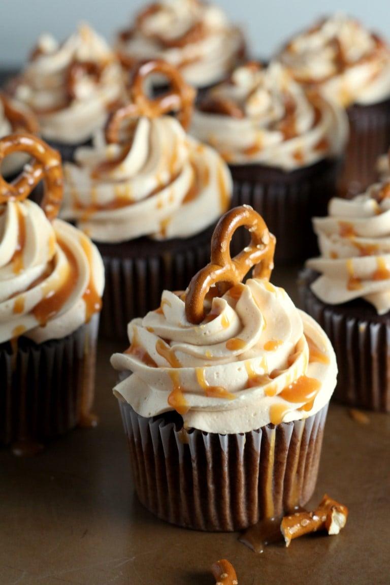 Mini salted caramel pretzel cupcakes on a dessert table