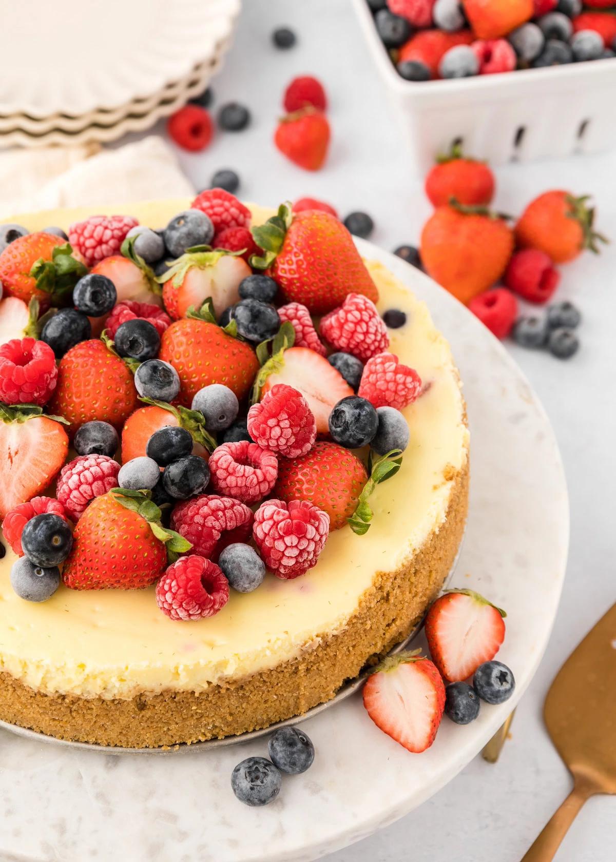slice of decadent cheesecake with fresh berries