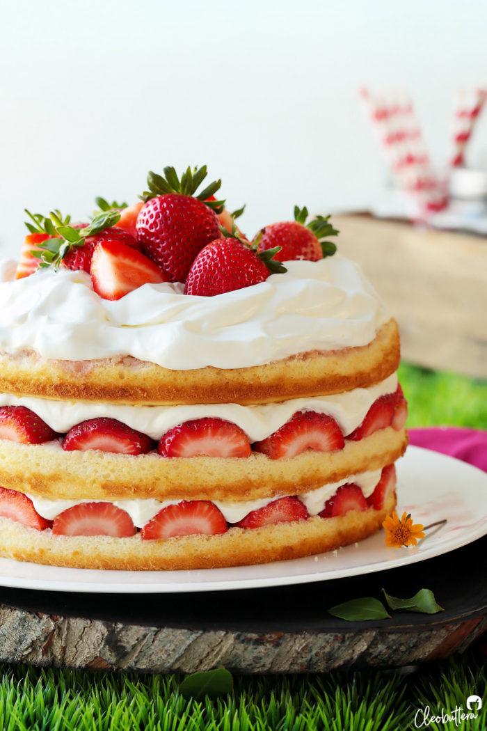 close-up shot of the layers of strawberry shortcake cake, highlighting the strawberries and cream