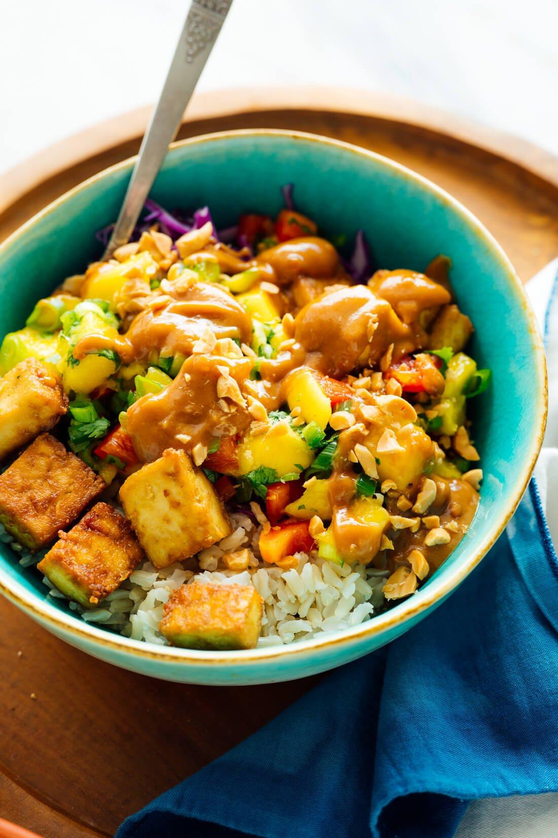 spicy mango tofu bowl with rice and vegetables