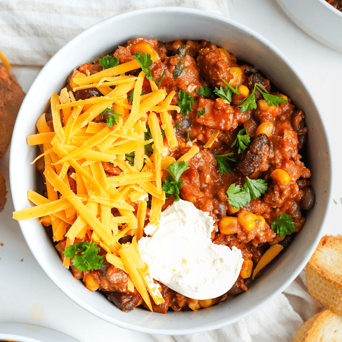 A skillet with ground beef simmering in a rich, dark Zinfandel reduction