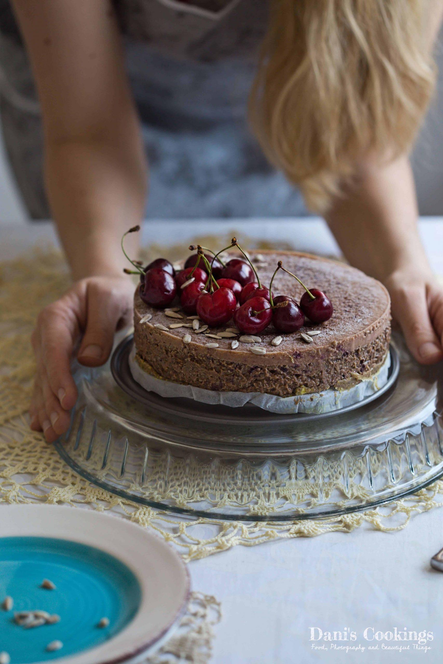 overhead shot of a whole rhubarb sunflower seed cake with slices cut