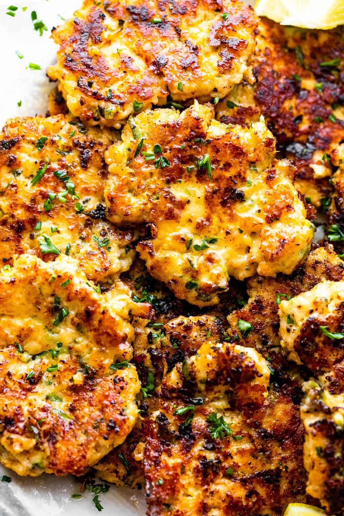 Frying Keto Chicken and Zucchini Fritters in a pan