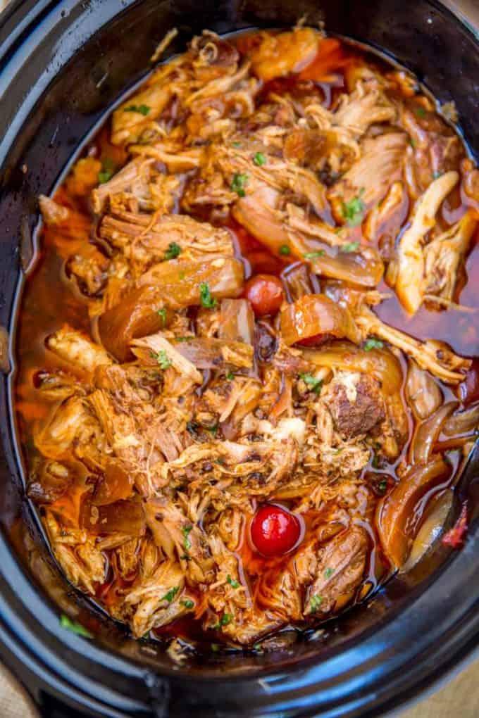 slow cooker filled with pulled pork and ghost peppers