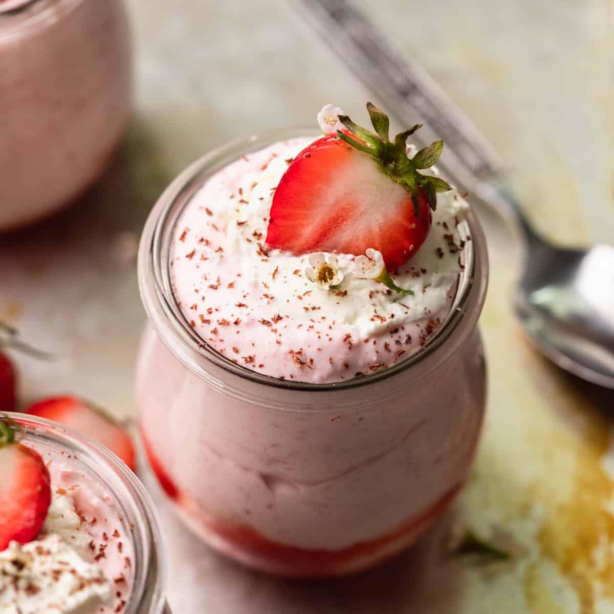 no-bake strawberry mousse being poured into a glass