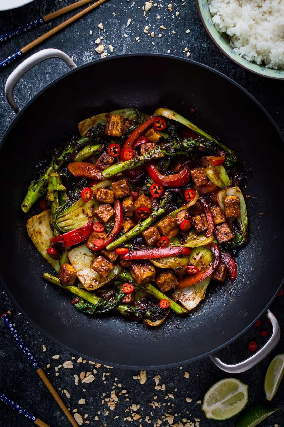 Spicy peanut tofu stir-fry in a wok