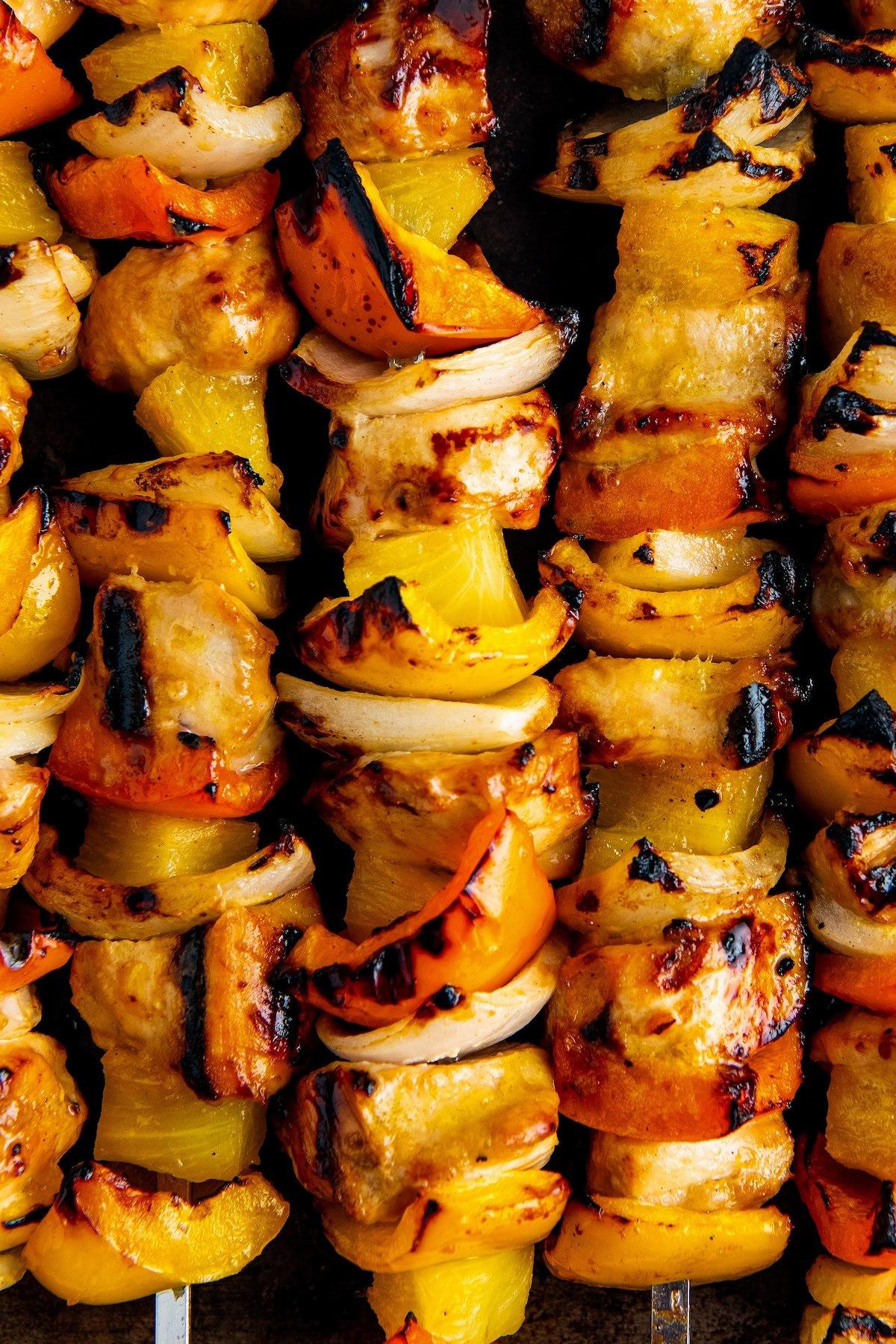 close up of grilled pineapple chicken skewers