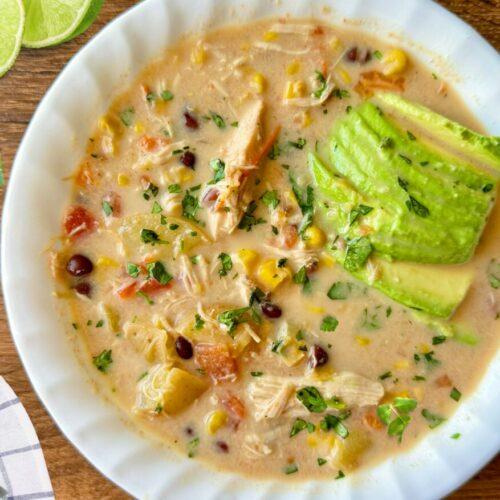 bowl of spicy corn chowder with chipotle peppers and cilantro