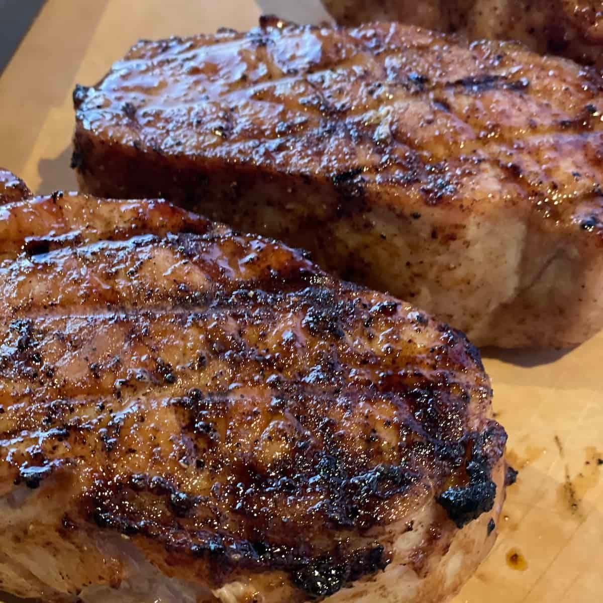 brown sugar bourbon glazed pork chops on a plate