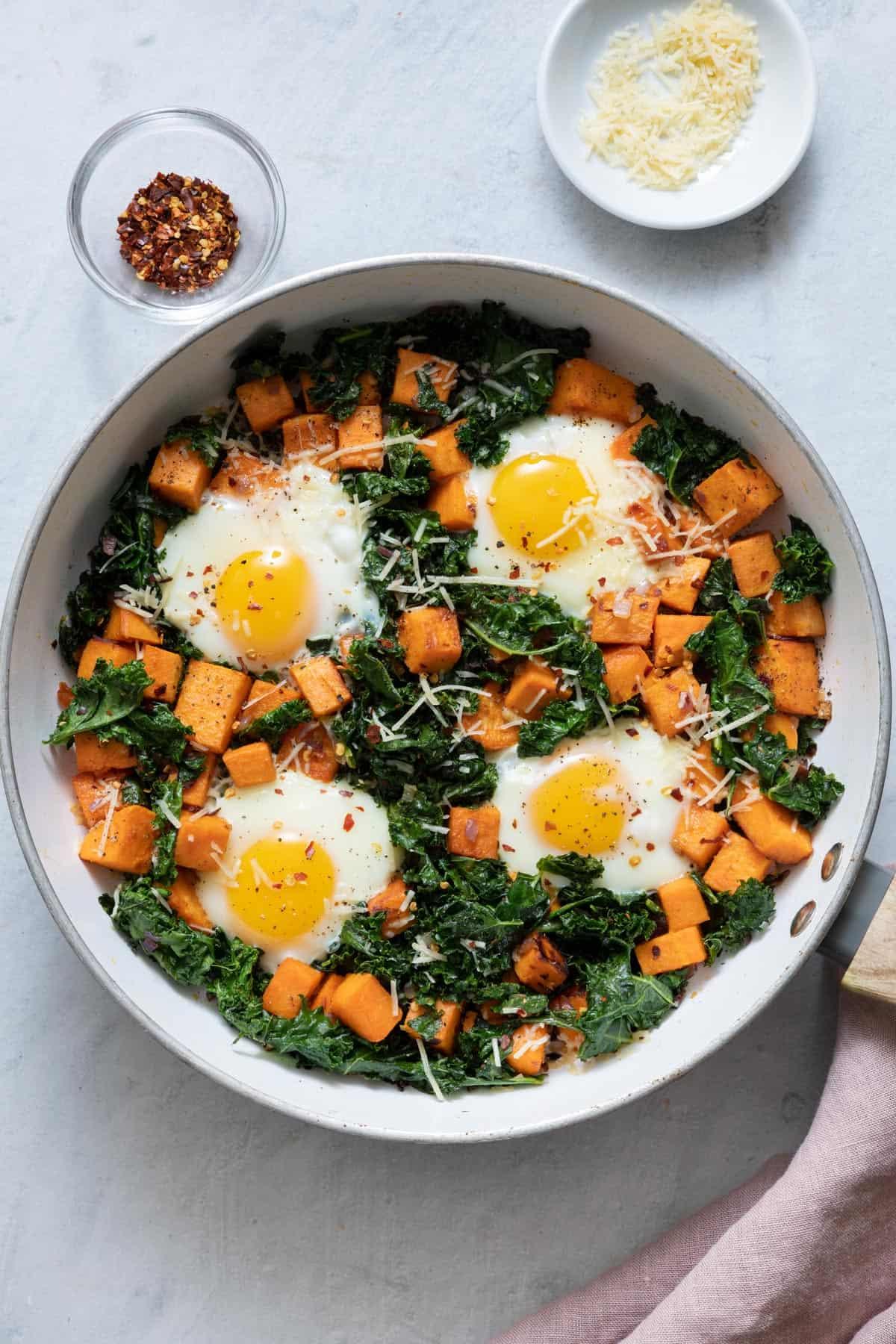 savory sweet potato kale hash topped with a fried egg