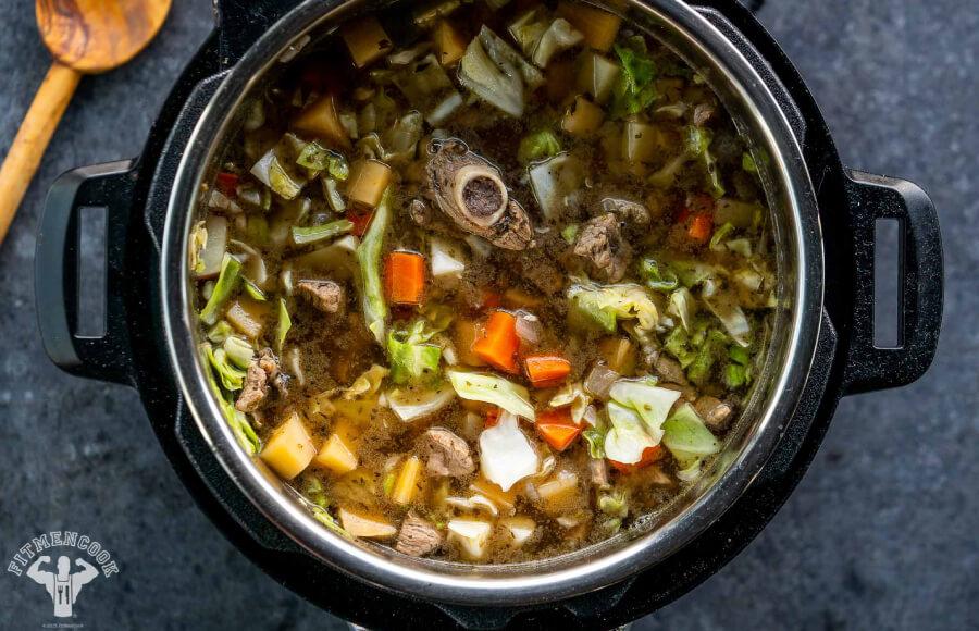 Close-up of a vibrant Icelandic Lamb Soup Protein Bowl with visible chunks of lamb and colorful vegetables.