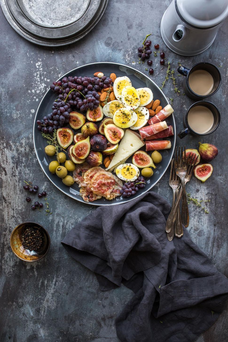 overhead shot of a beautifully arranged monochromatic cheese platter