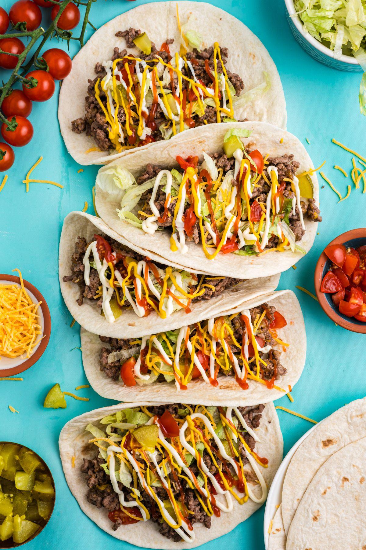 overhead shot of cranberry orange ground beef tacos being assembled