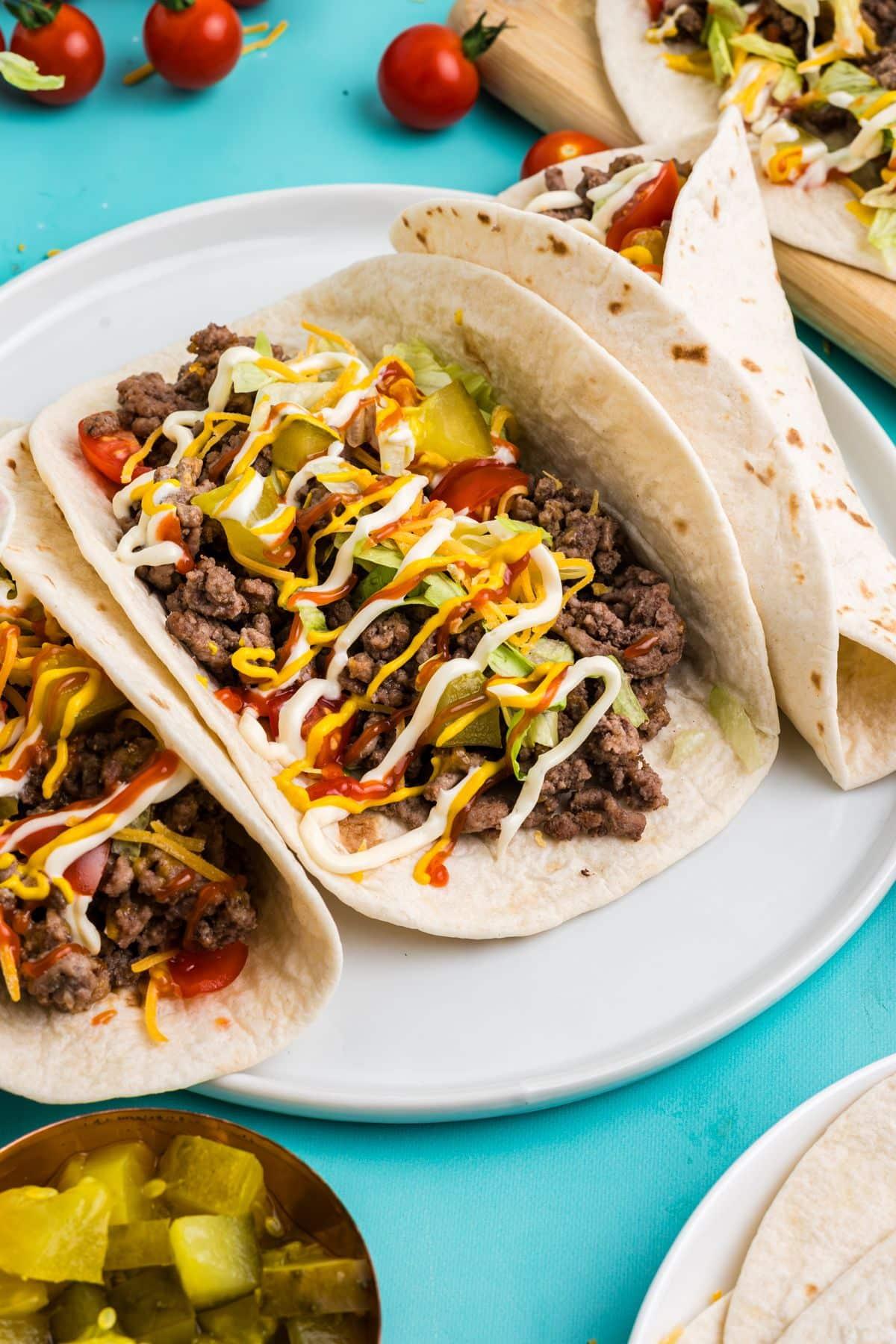 cranberry orange ground beef tacos on a plate