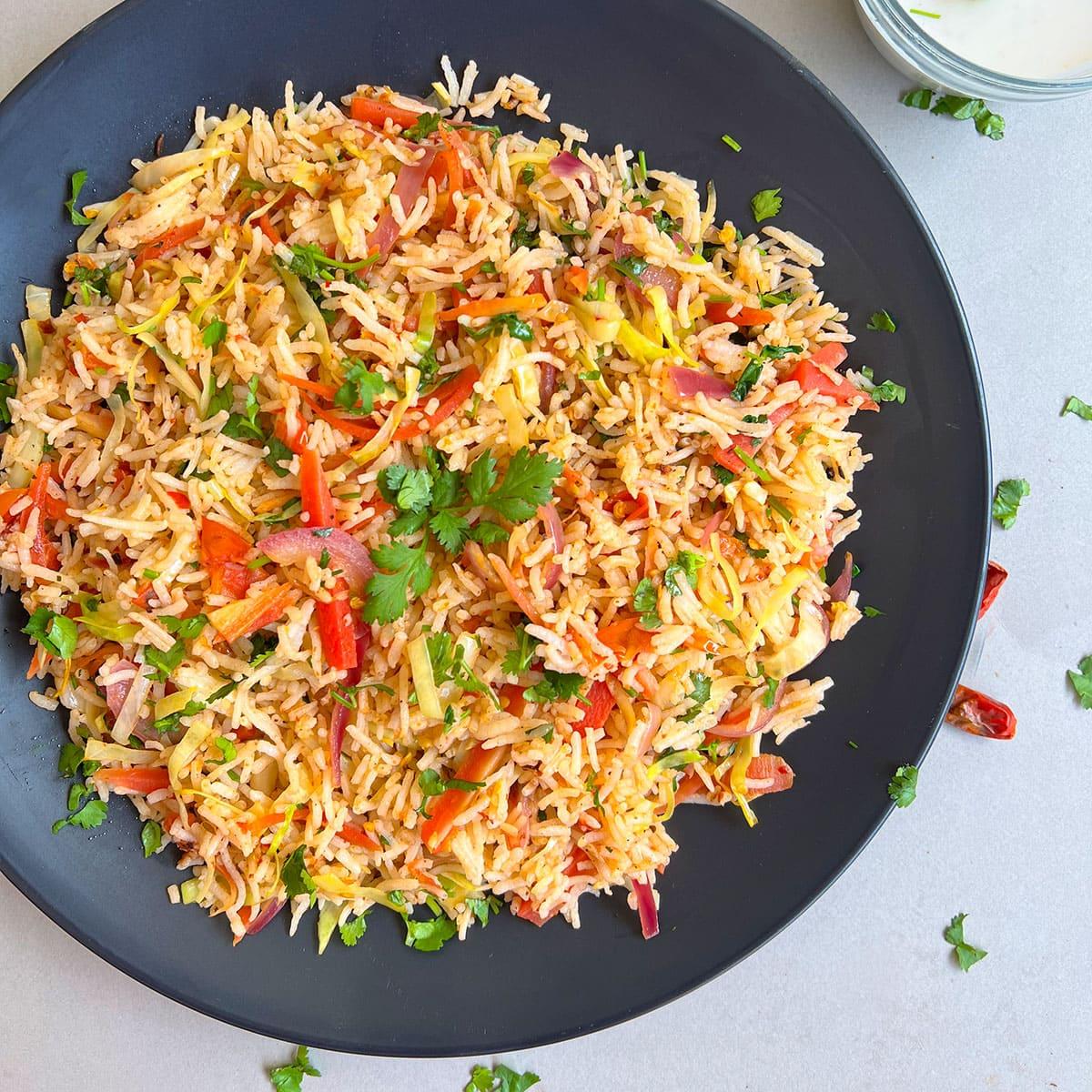 Close-up shot of Indian Spiced Vegetable Fried Rice showing texture and spices