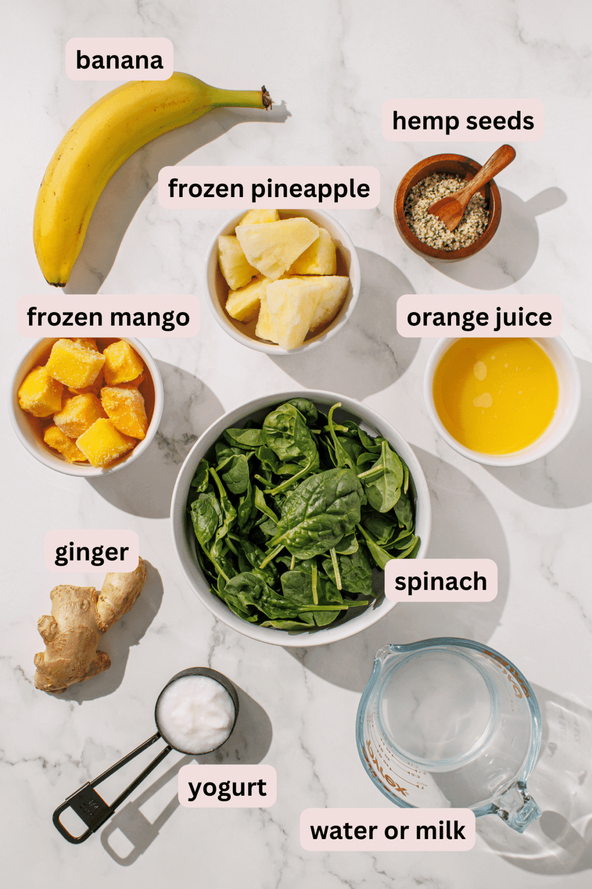 ingredients for a green smoothie laid out on a counter