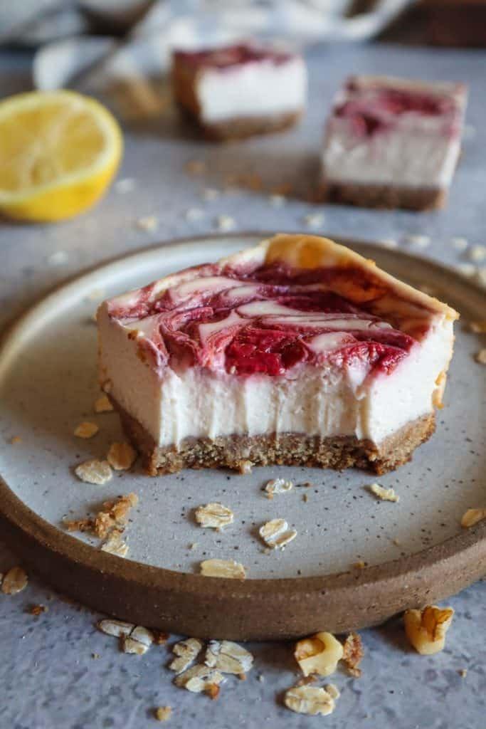 strawberry swirl on top of gluten-free cheesecake bar