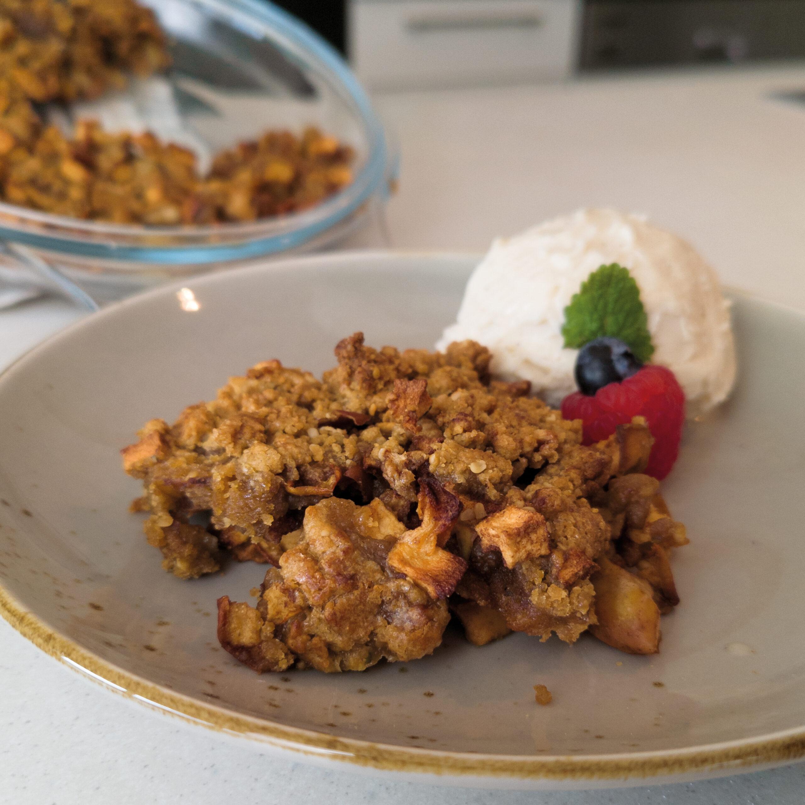 warm pear crisp with hemp seeds in a rustic setting