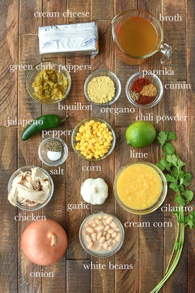 various ingredients for yuzu habanero chicken chili laid out on a wooden table