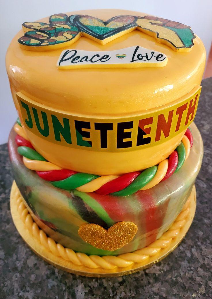 a complete red velvet cake decorated with Juneteenth themed toppers