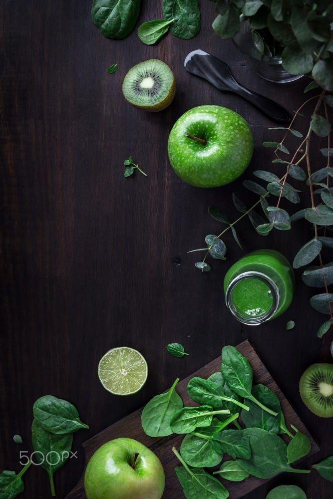 close-up of spinach leaves and apples
