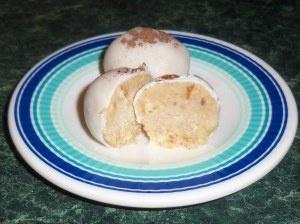 close up of Tres Leches cake pops on a decorative plate