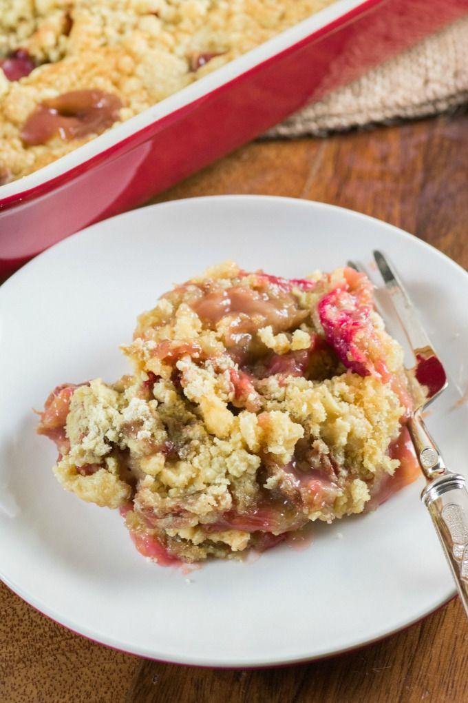 slice of maple pecan rhubarb dump cake being served on a plate with a fork