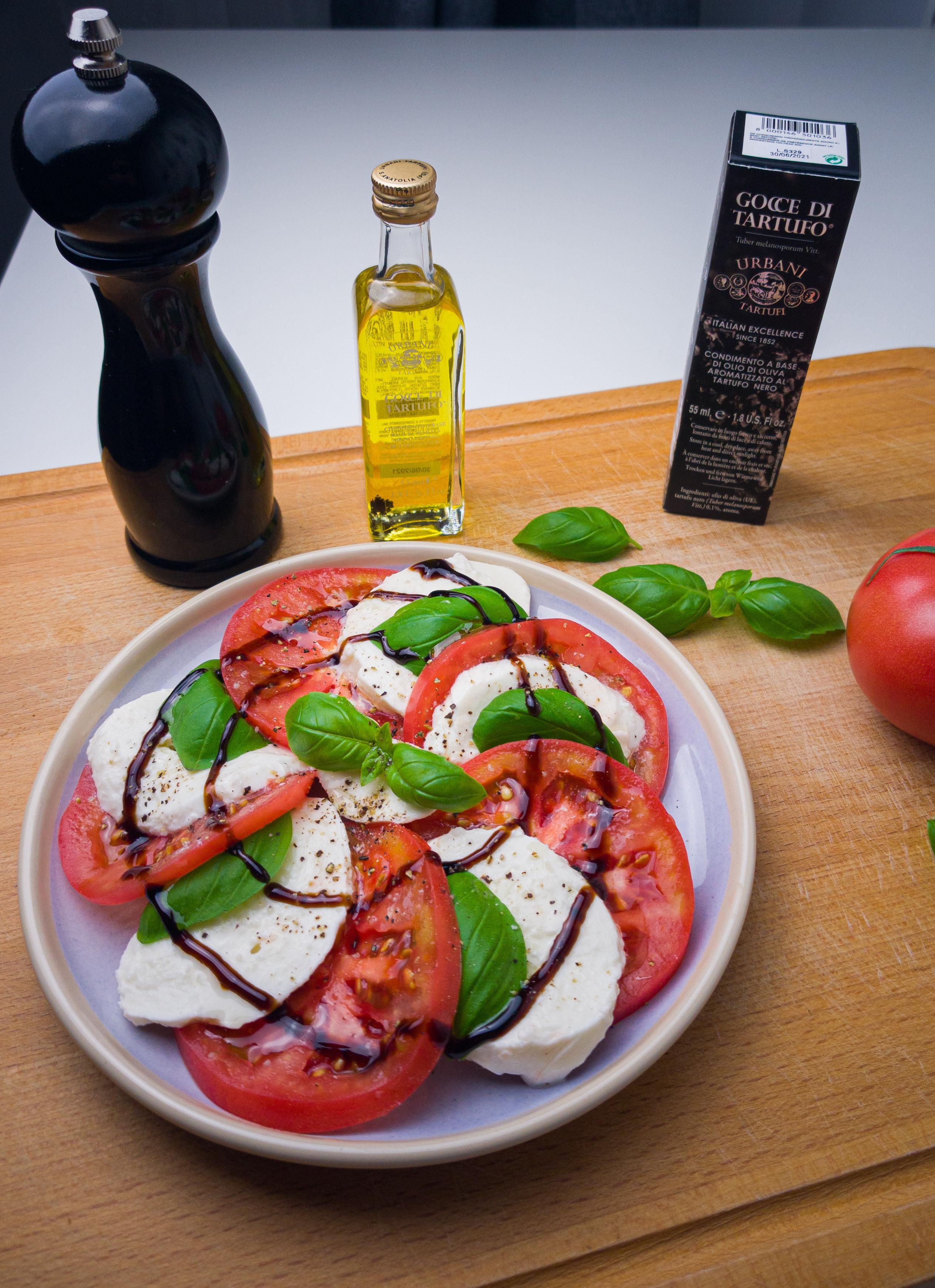 Truffle Infused Caprese Salad on a white plate