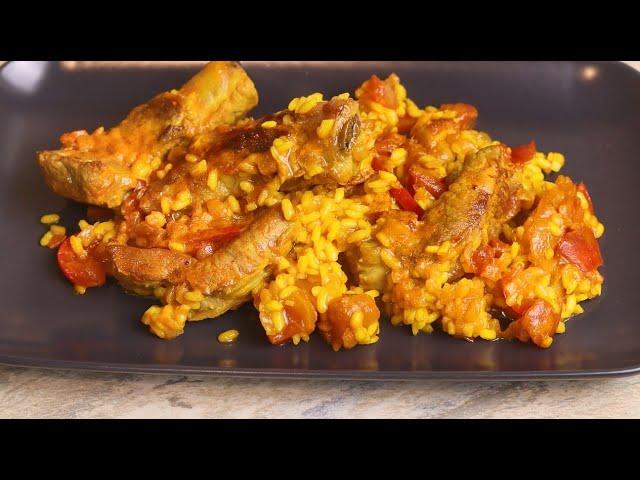 Close-up of a paella baked apple, showcasing the saffron rice filling and tender apple exterior