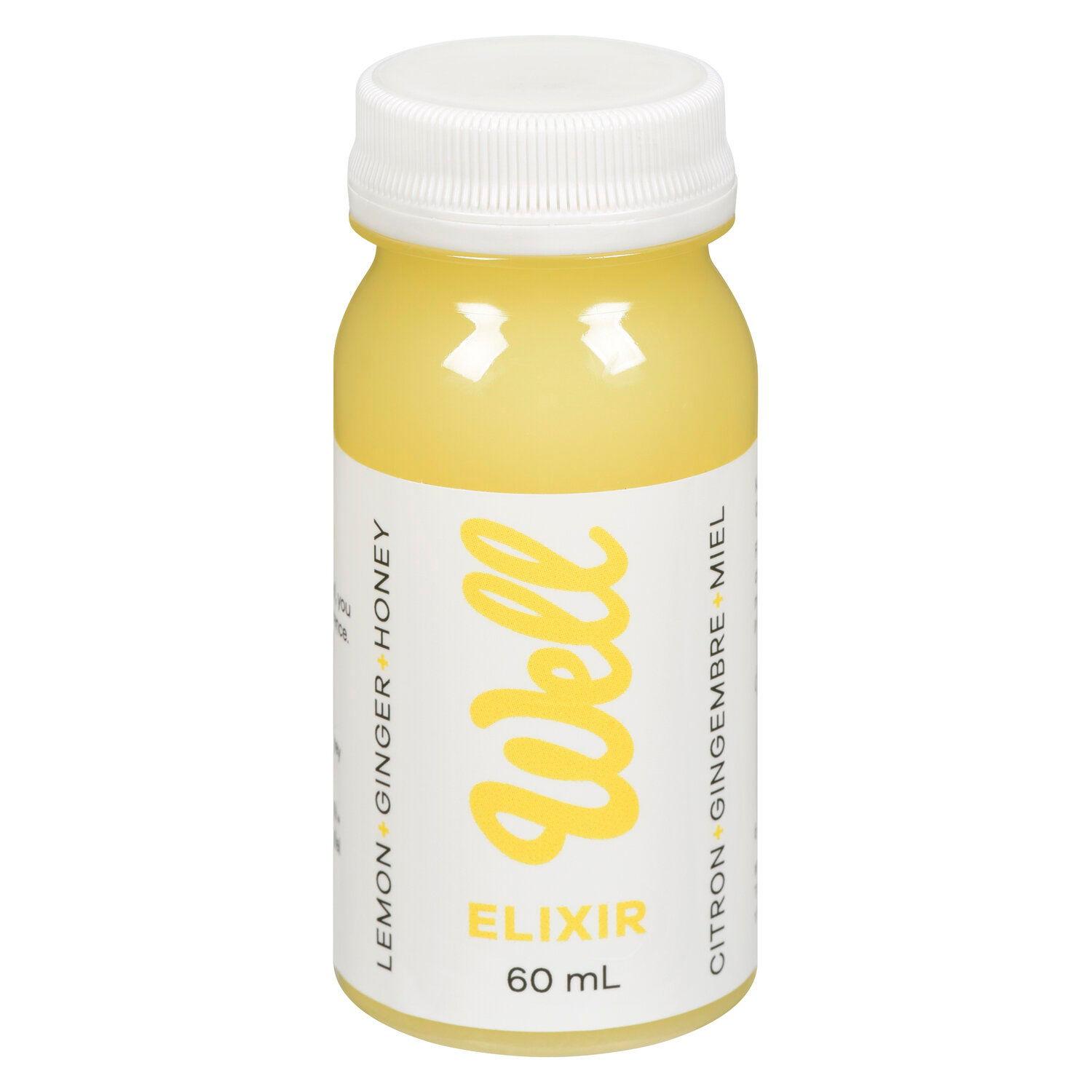 woman smiling while drinking ginger elixir