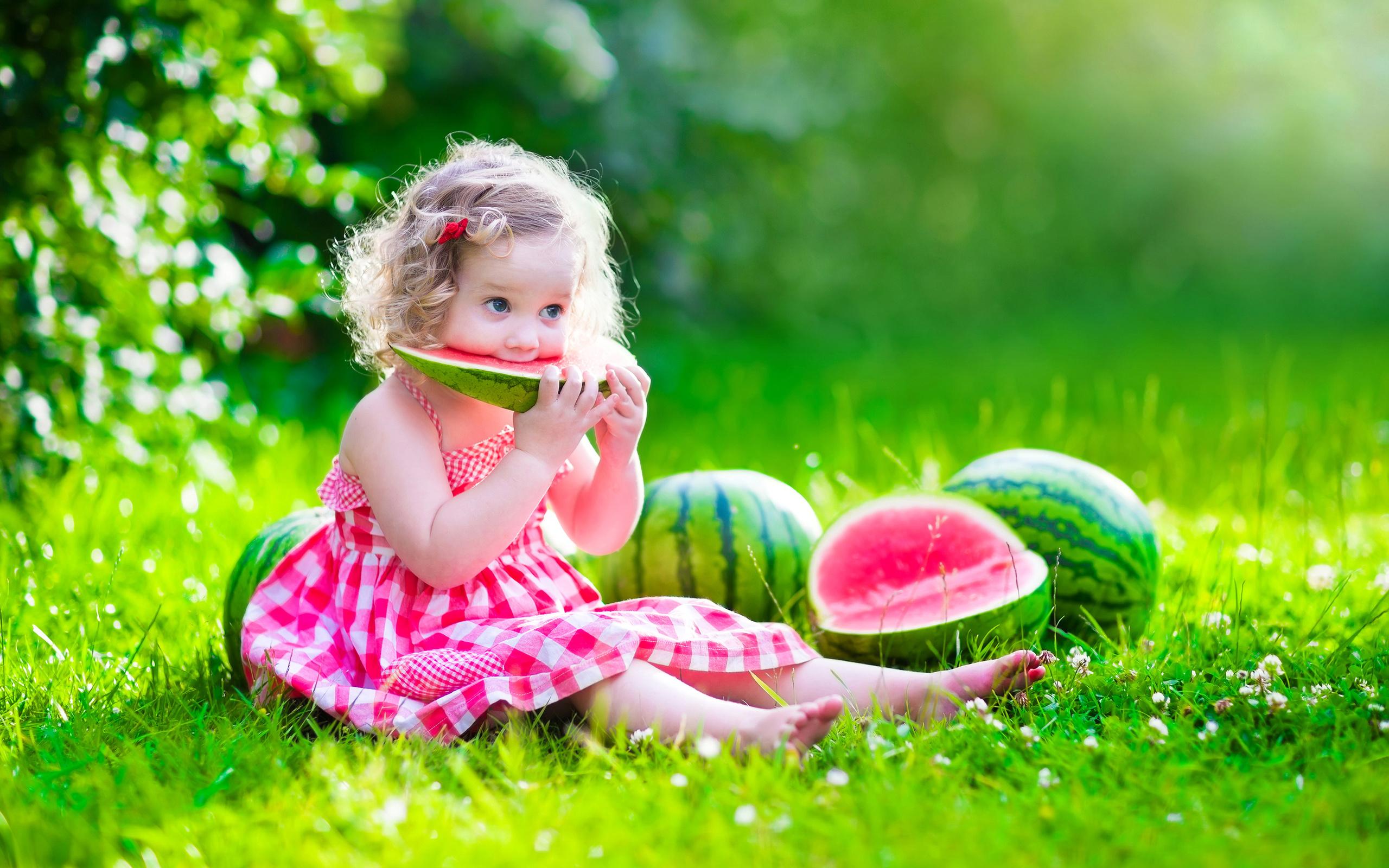 a person enjoying a watermelon lassi outdoors, with a bright, sunny background