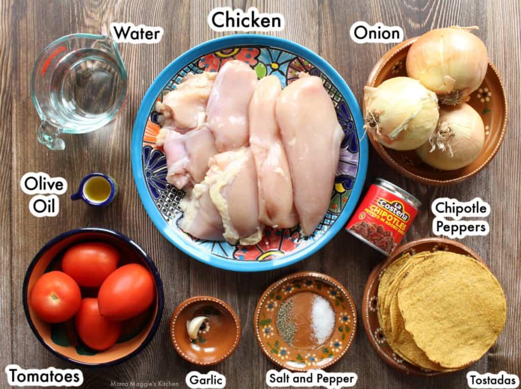 Ingredients for Chicken Tinga Tostadas laid out on a table