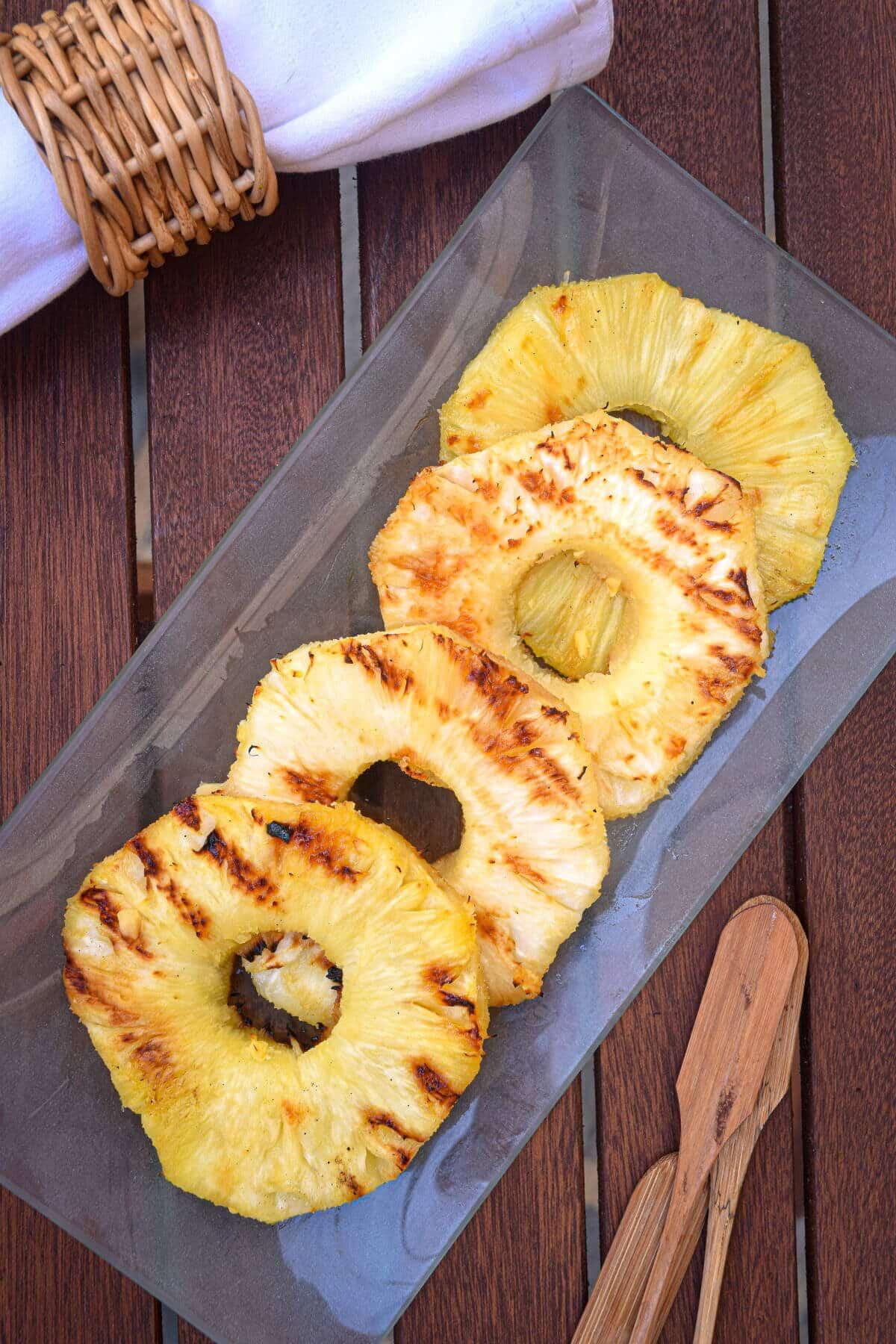 overhead shot of perfectly grilled pineapple slices with visible grill marks