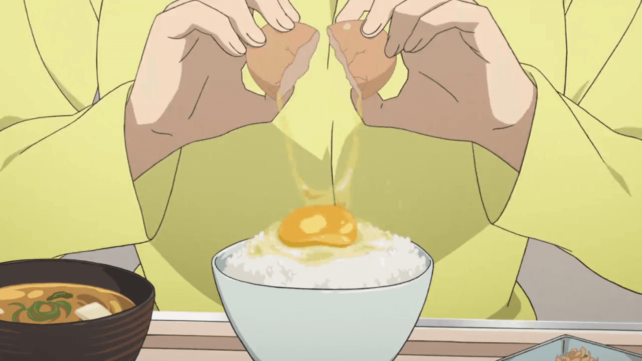 a person happily eating an egg and brown rice bowl with a spoon