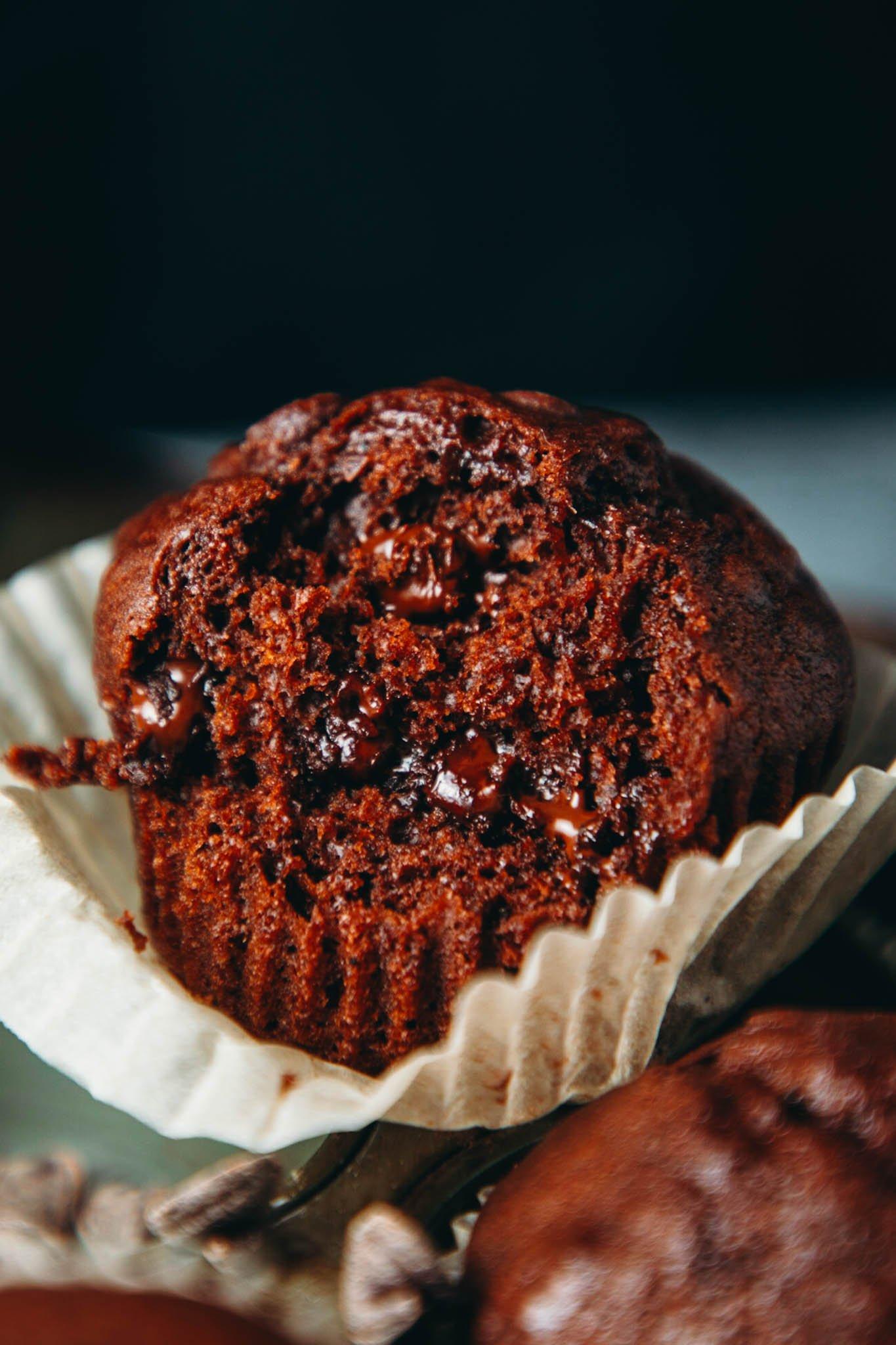 a batch of freshly baked vegan brownie muffins cooling on a wire rack