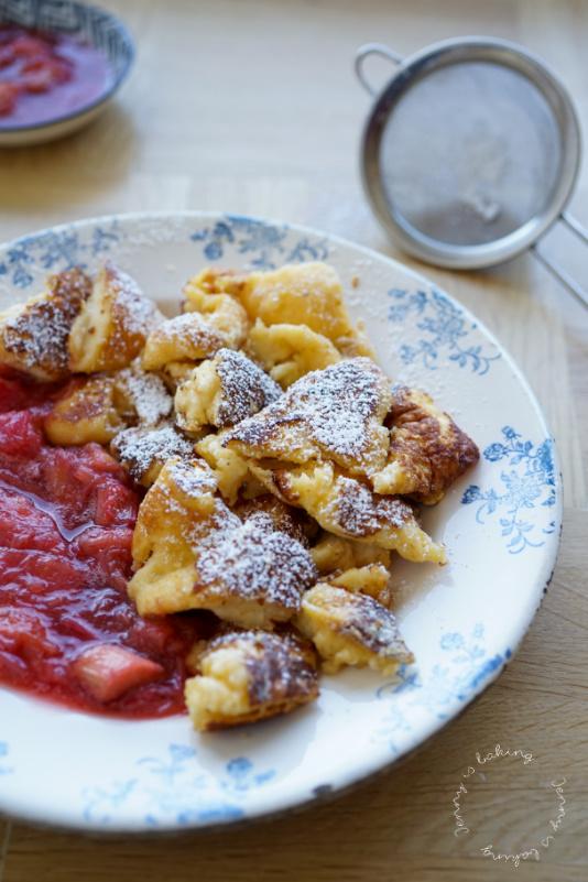 whiskey fig rhubarb compote being spooned onto pancakes