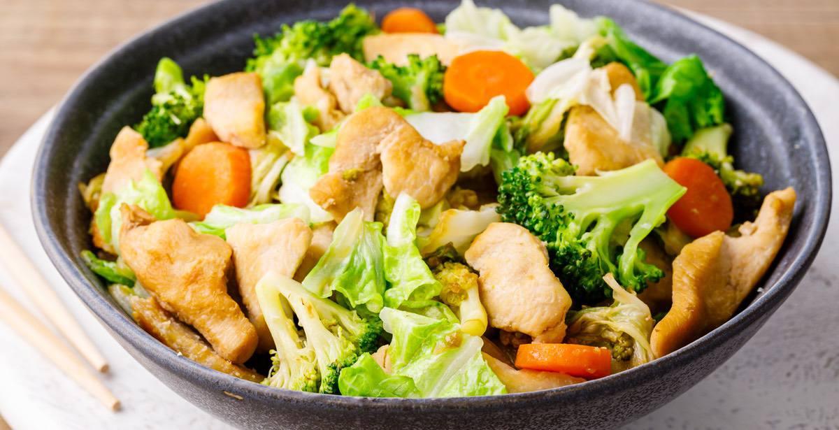 A bowl of freshly made keto chicken and cabbage stir-fry