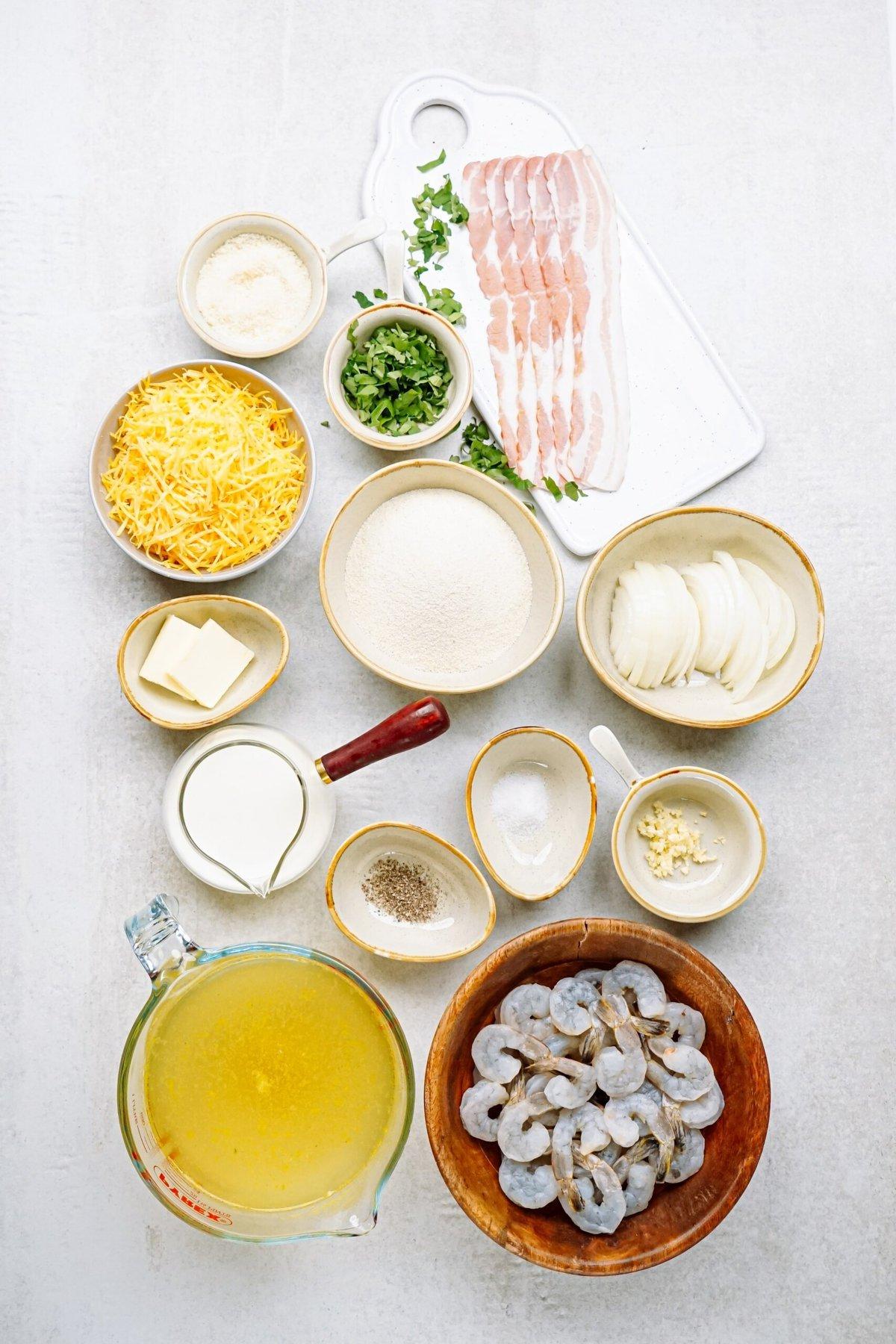 ingredients for shrimp and grits laid out on a wooden table