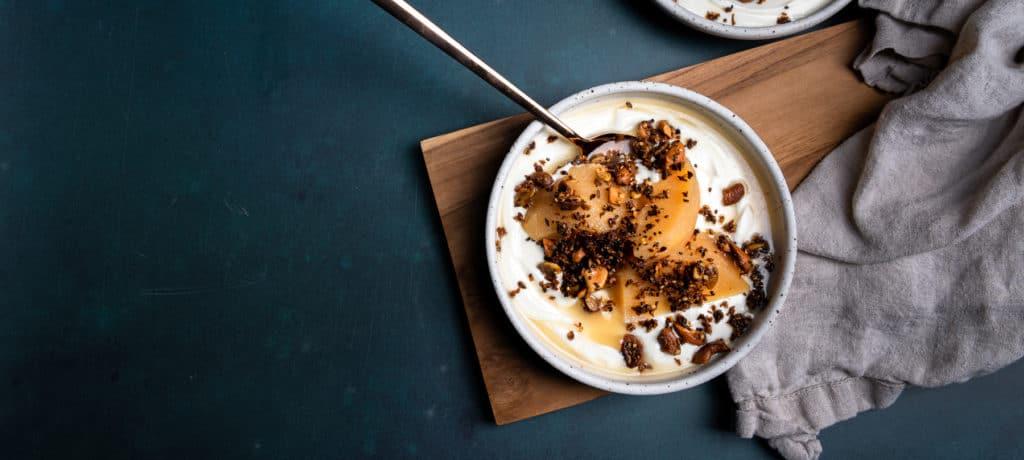 Close-up shot of the quince cinnamon frozen yogurt compote being scooped into a bowl