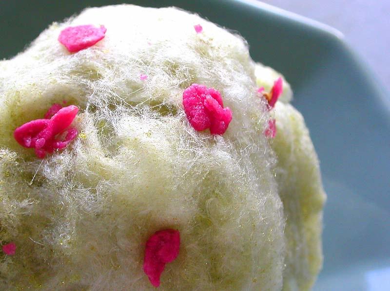 Matcha cotton candy displayed on a plate