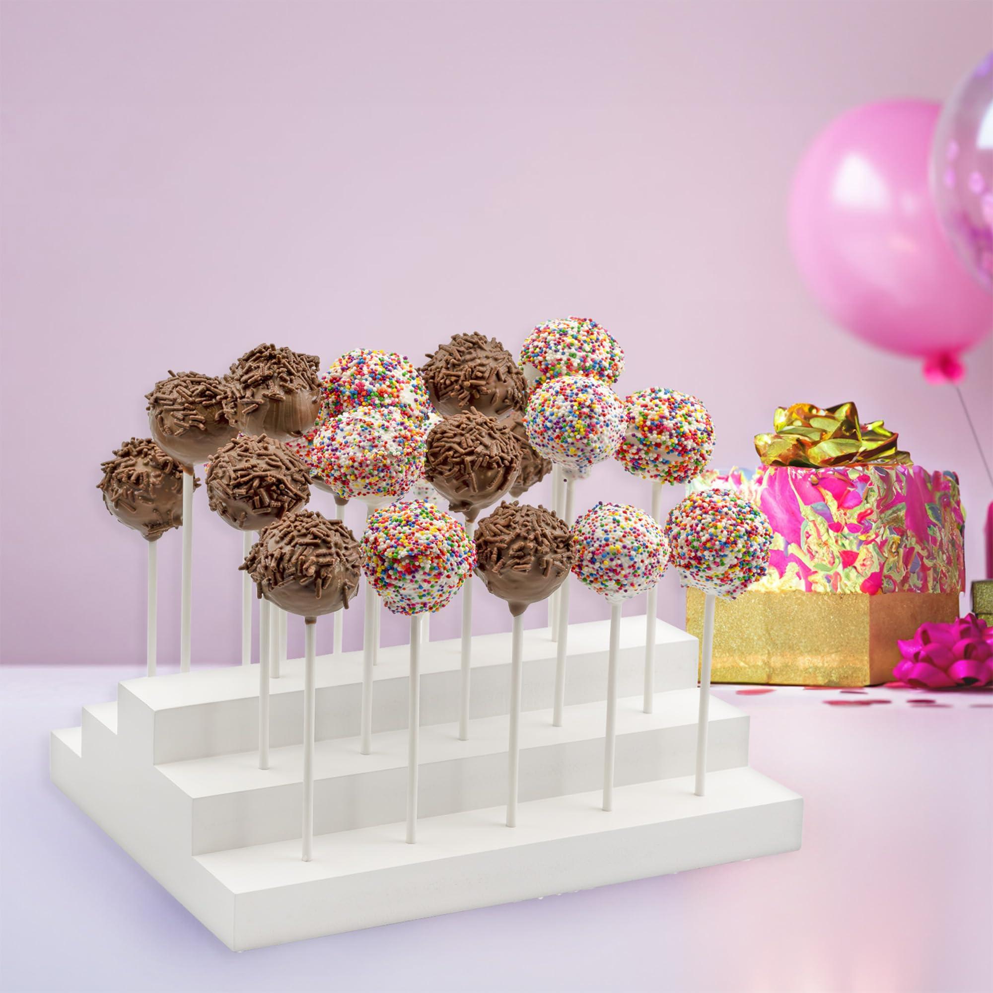 Assorted cake pops displayed on a stand